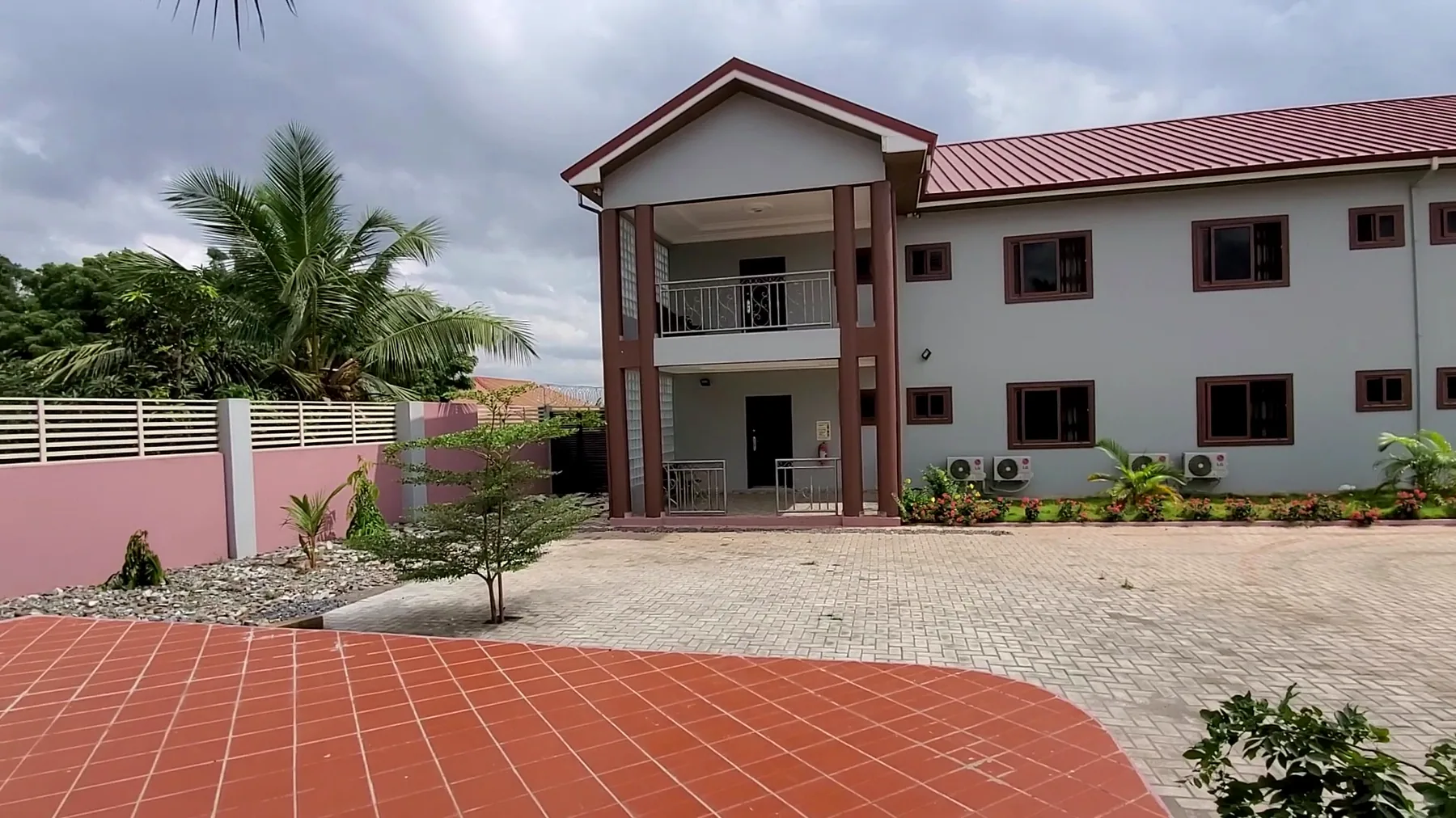 Guest wing and paved courtyard