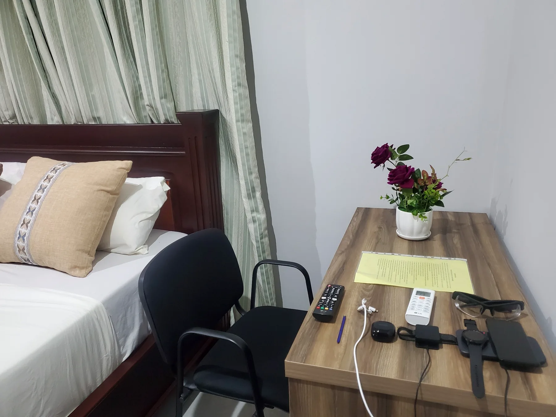 Guest room bed and desk area